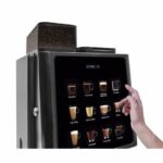 Coffee machine with touchscreen selection for beverages.