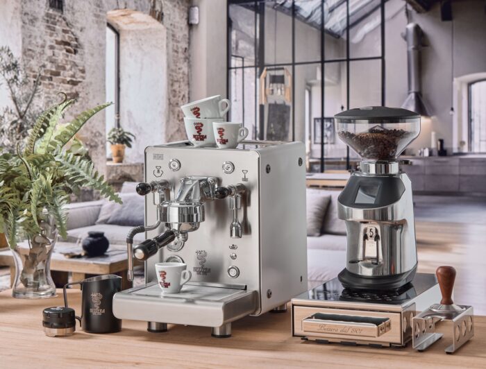 Elegant coffee machine and grinder in stylish kitchen.