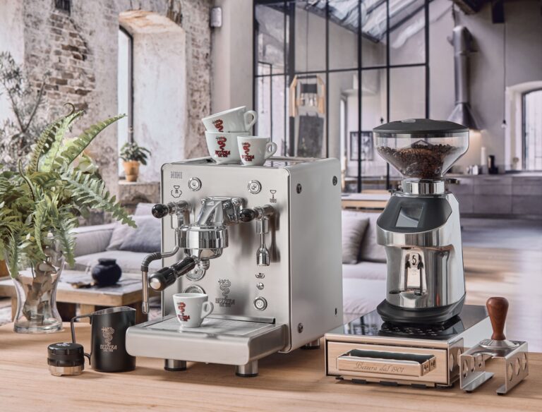 Elegant coffee machine and grinder in stylish kitchen.