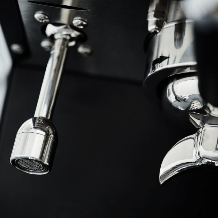 Close-up of a shiny espresso machine component.