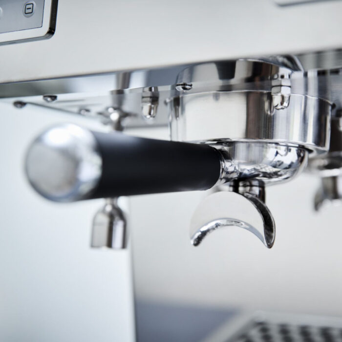 Close-up of a coffee machine's portafilter.
