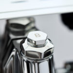 Close-up of a chrome hexagonal knob marked 'B'.