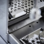 Close-up of a metallic grater surface.