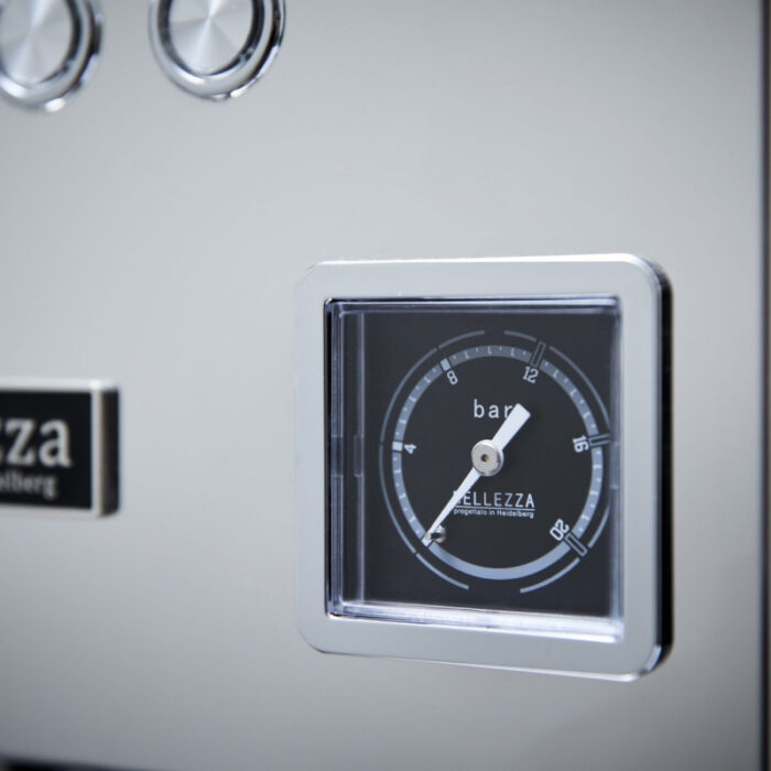 Close-up of a pressure gauge on coffee machine.