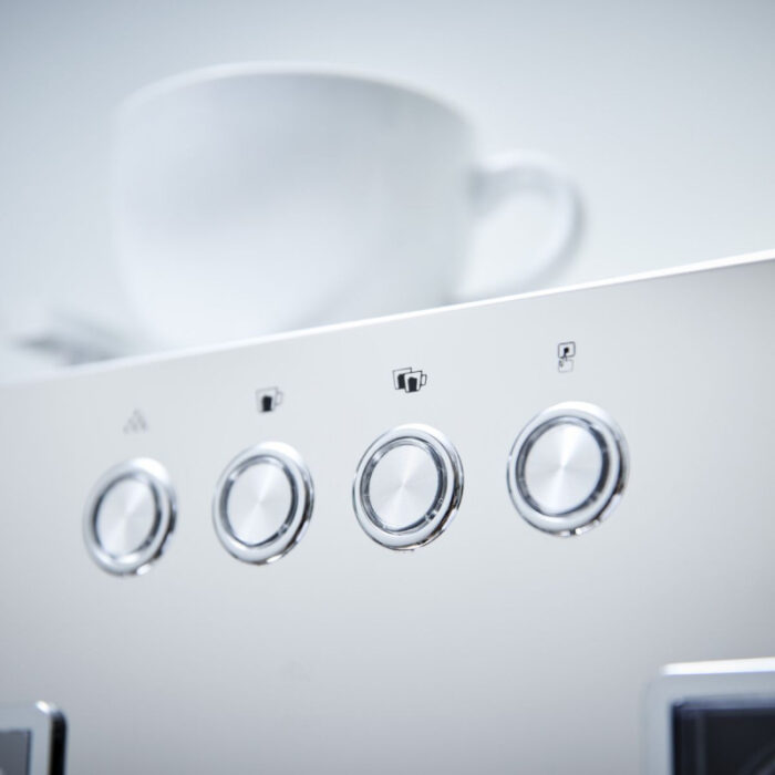 Close-up of an espresso machine control panel.