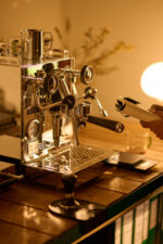 Shiny coffee machine on a wooden counter