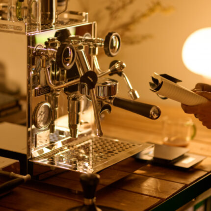 Shiny coffee machine on a wooden counter