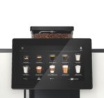 Coffee machine touchscreen displaying various drink options.