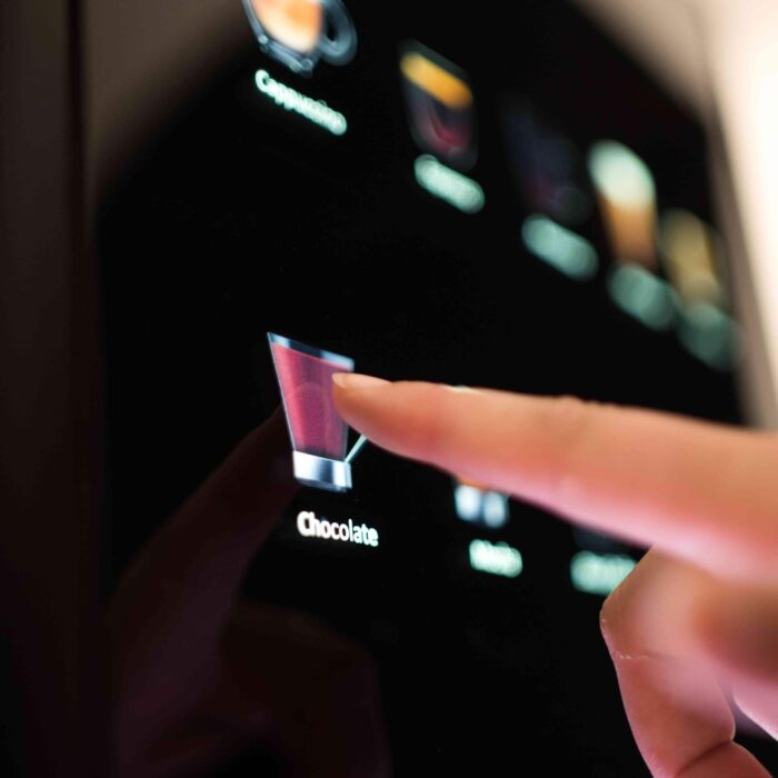 User selects chocolate drink on touchscreen menu.