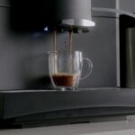 Espresso pouring from the Bestir BM30 into a glass cup