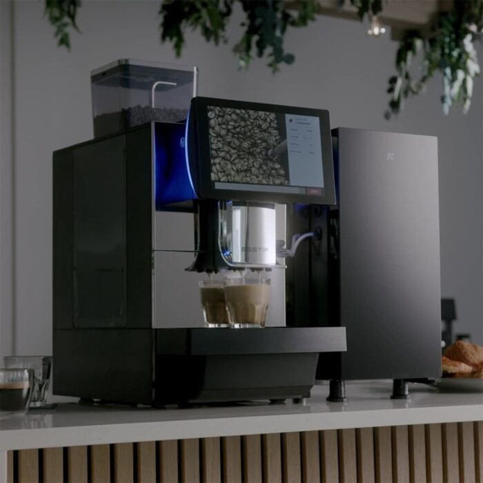 Coffee pouring from the Bestir BM80 with the bean hopper visible