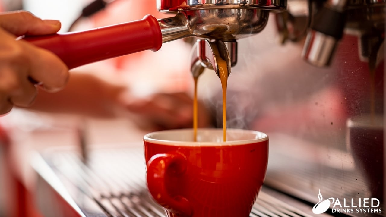 Barista pulling espresso shot on machine