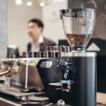 Mahlkönig E80 Supreme coffee grinder in use on a coffee bar